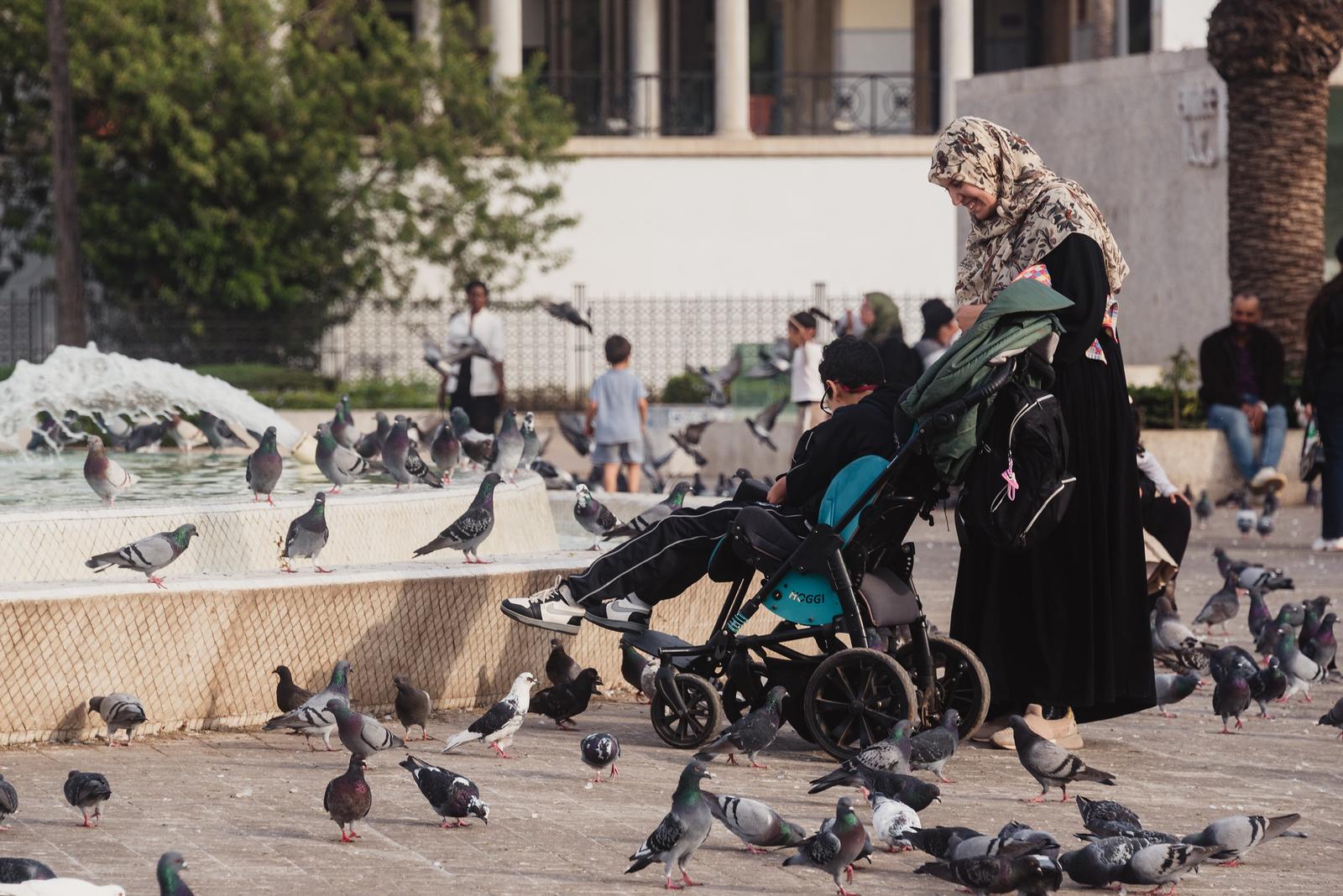 A Mother Walking Her Child at the Square