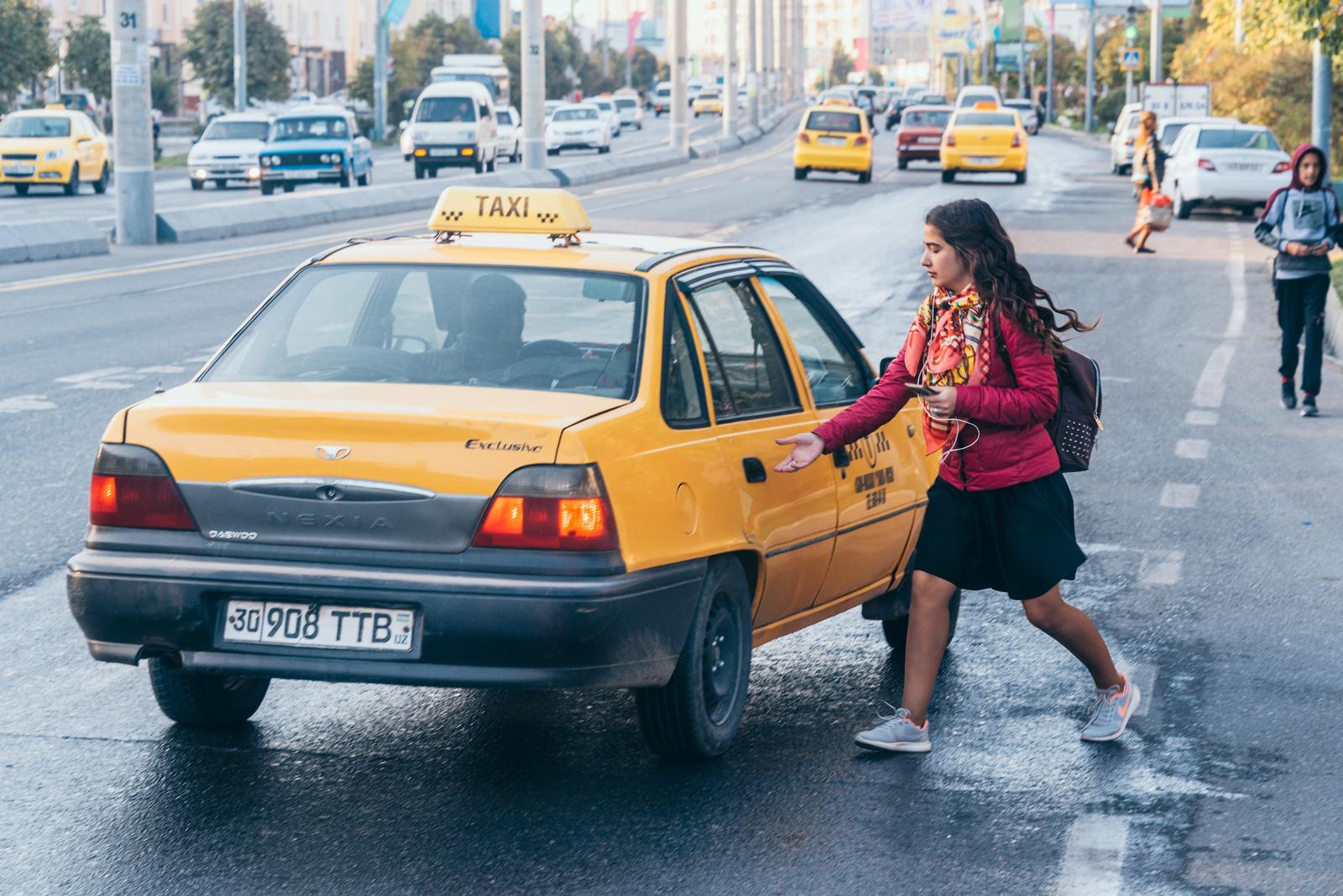 A Girl Hailing Yellow Taxi