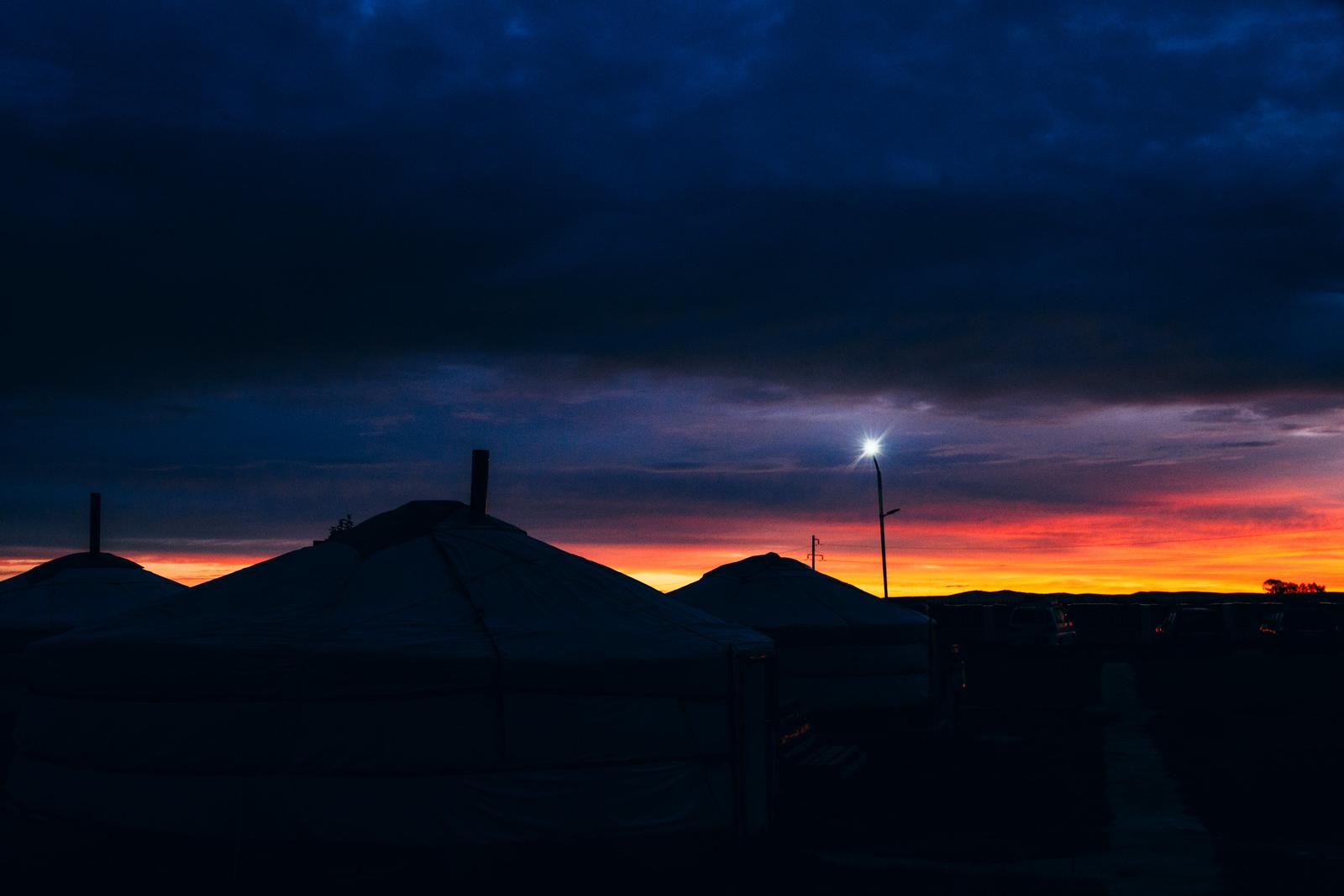 Yurt Silhouettes under the Sunrise