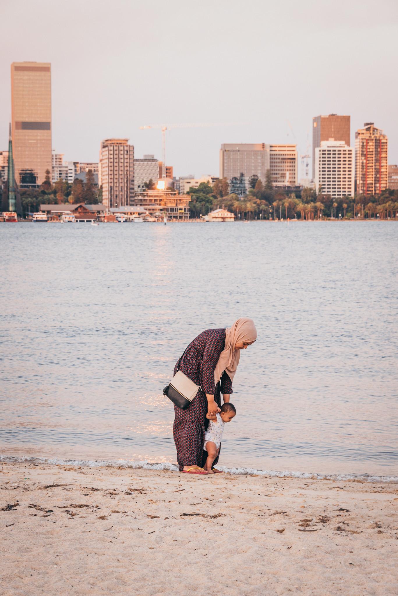 A Mom with Her Daughter by Swan River