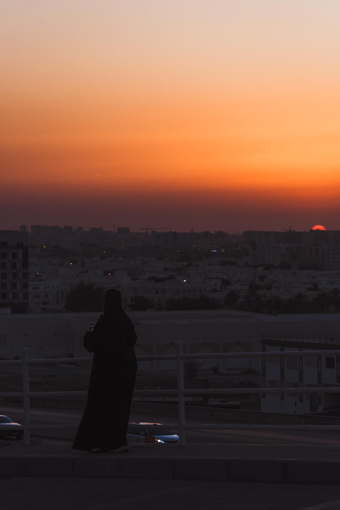 A Woman in Front of the Setting Sun