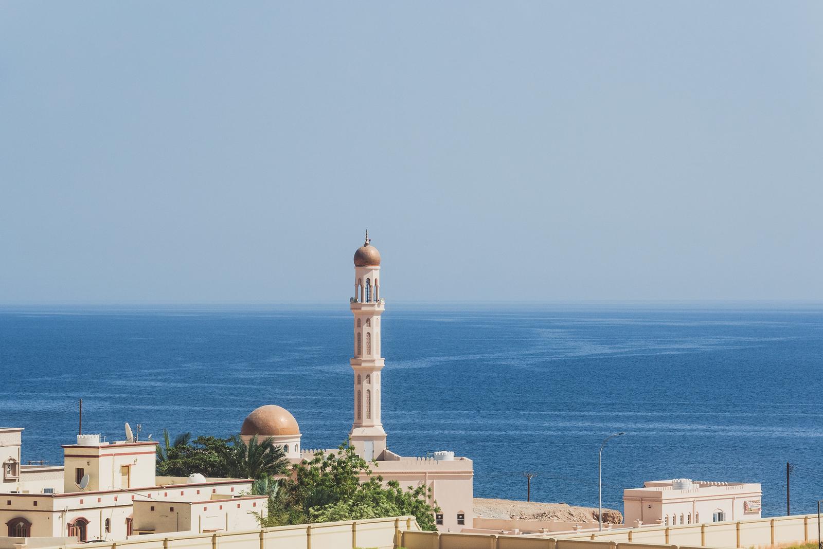 The Minaret Rising against the Sea Backdrop