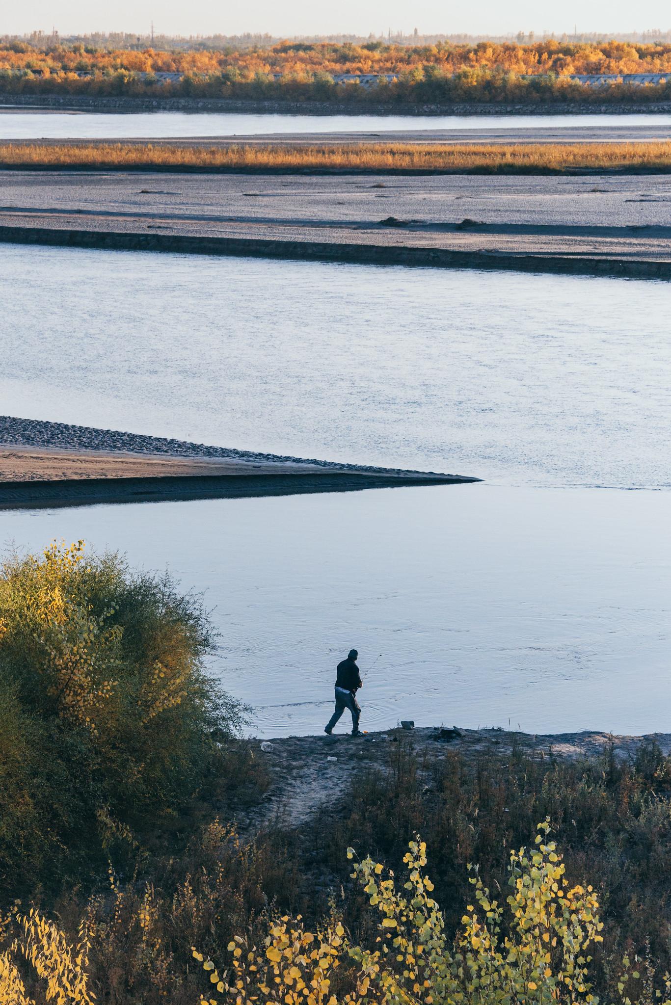 A Man Fishing on the River