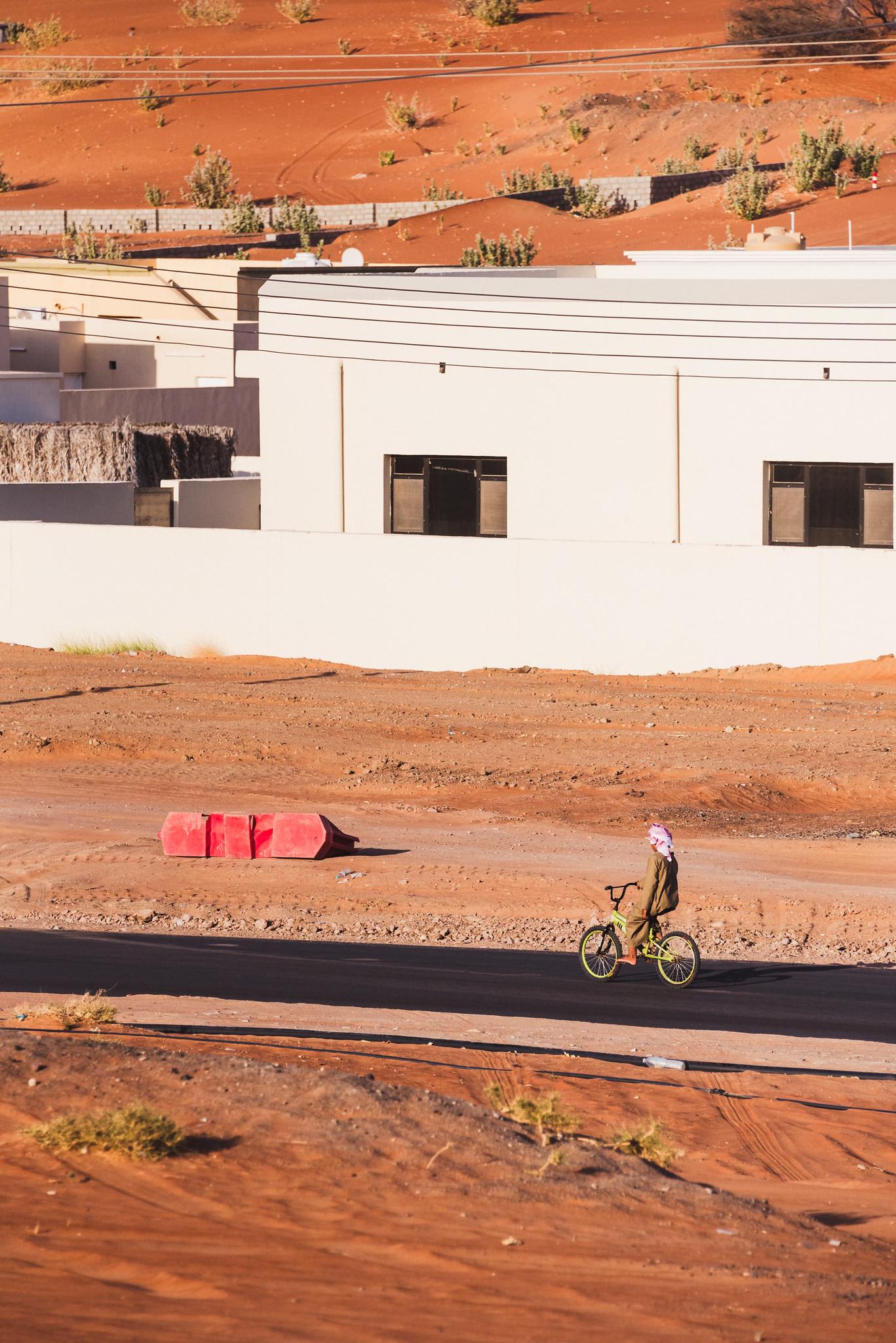 Asphalt Road Cutting through the Red Sand