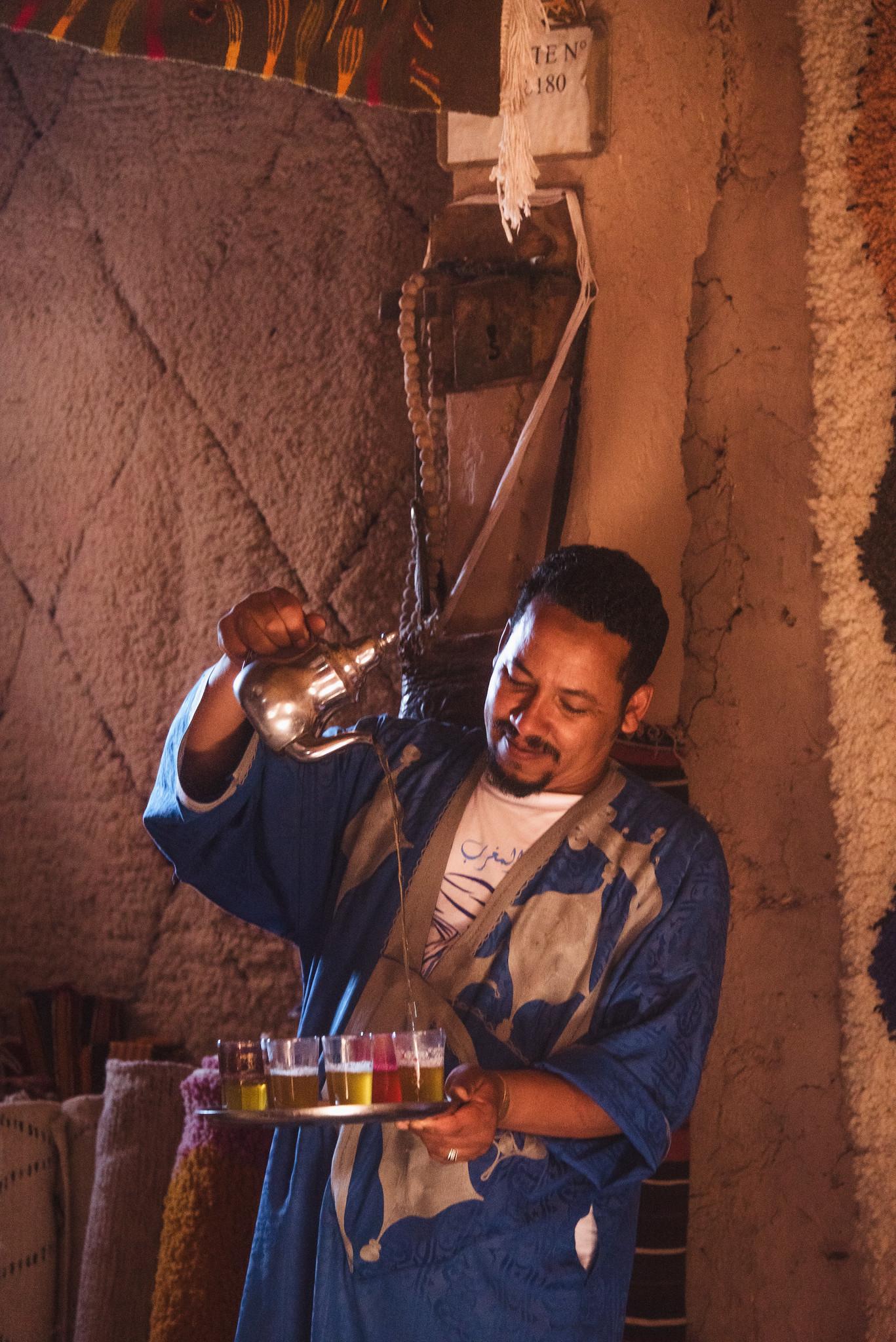 The Shop Owner Pouring Tea